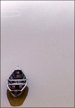 An empty boat on still water