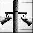 Speakers on a pole.