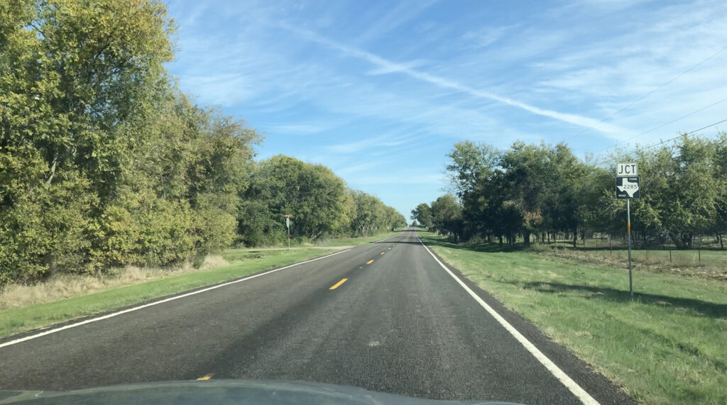 A country road in the beginnings of East Texas.