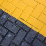 Bricks - one side painted black...the other side, yellow.