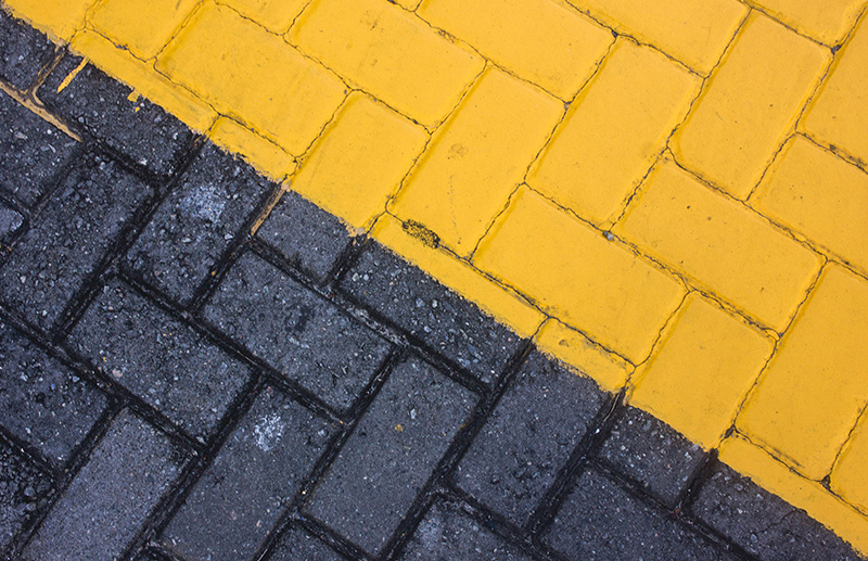 Bricks - one side painted black...the other side, yellow.