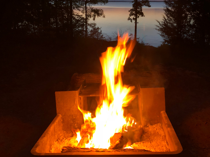 Campfire with the lake in the background.