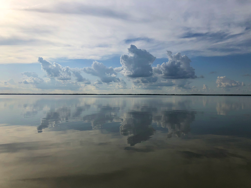 Clouds reflected on Jim Chapman Lake.