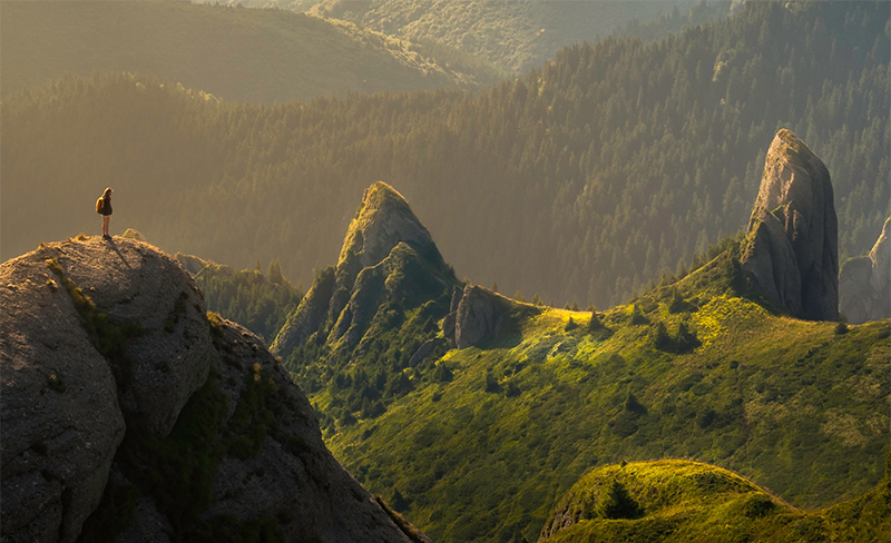 woman standing in the mountains