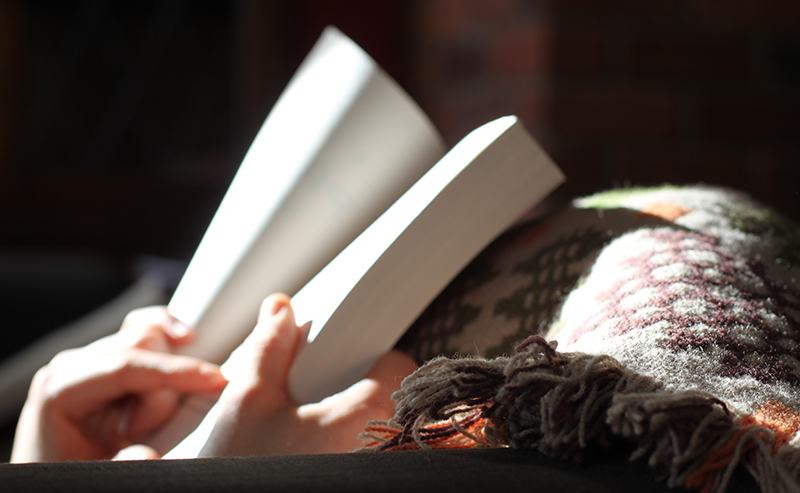 Woman's hands holding a book