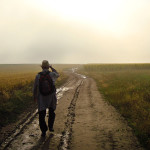 Man walking down a dirt road