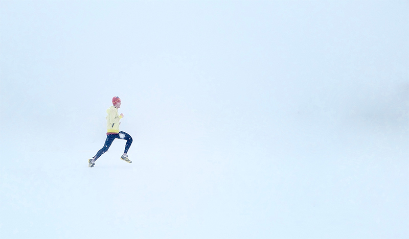 Man running in the snow.