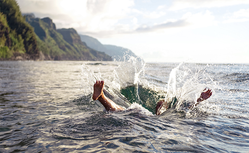 Person splashing down into a lake.