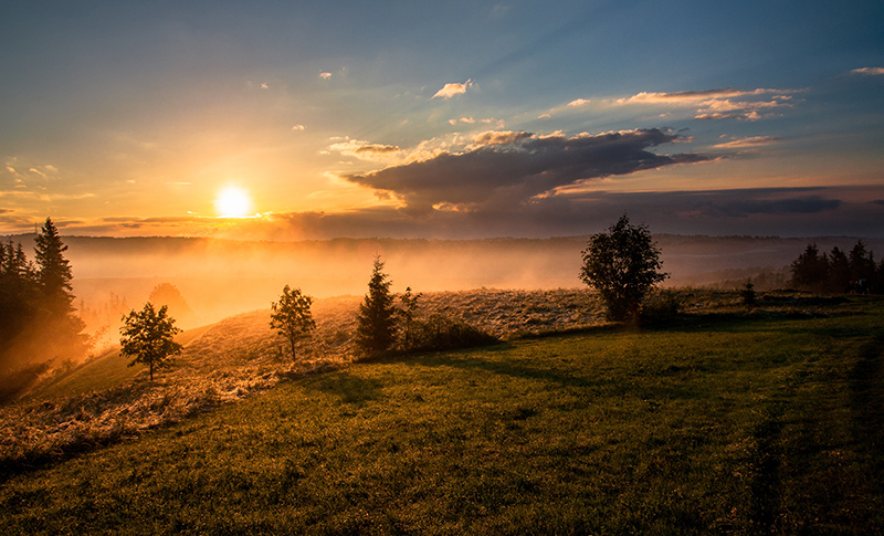 Sunrise over a hill.