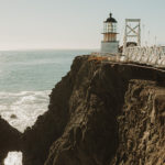 Lighthouse at end of walkway.