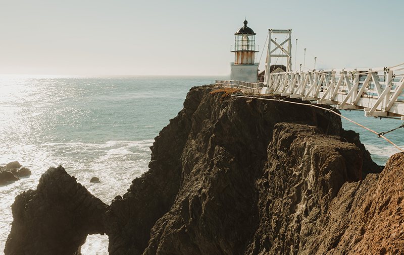 Lighthouse at end of walkway.