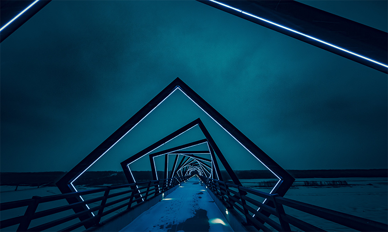 Lighted walkway at night.