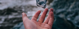 Hand tossing a stone in the air